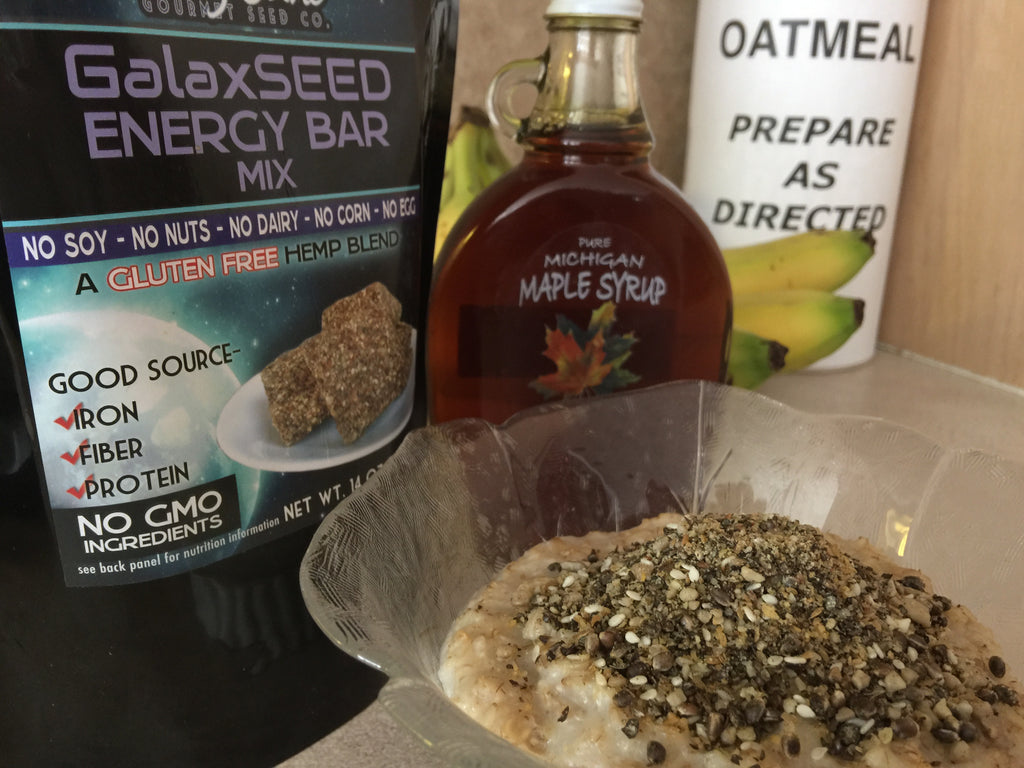 GalaxSeed energy bar mix in oatmeal with maple syrup bottle 